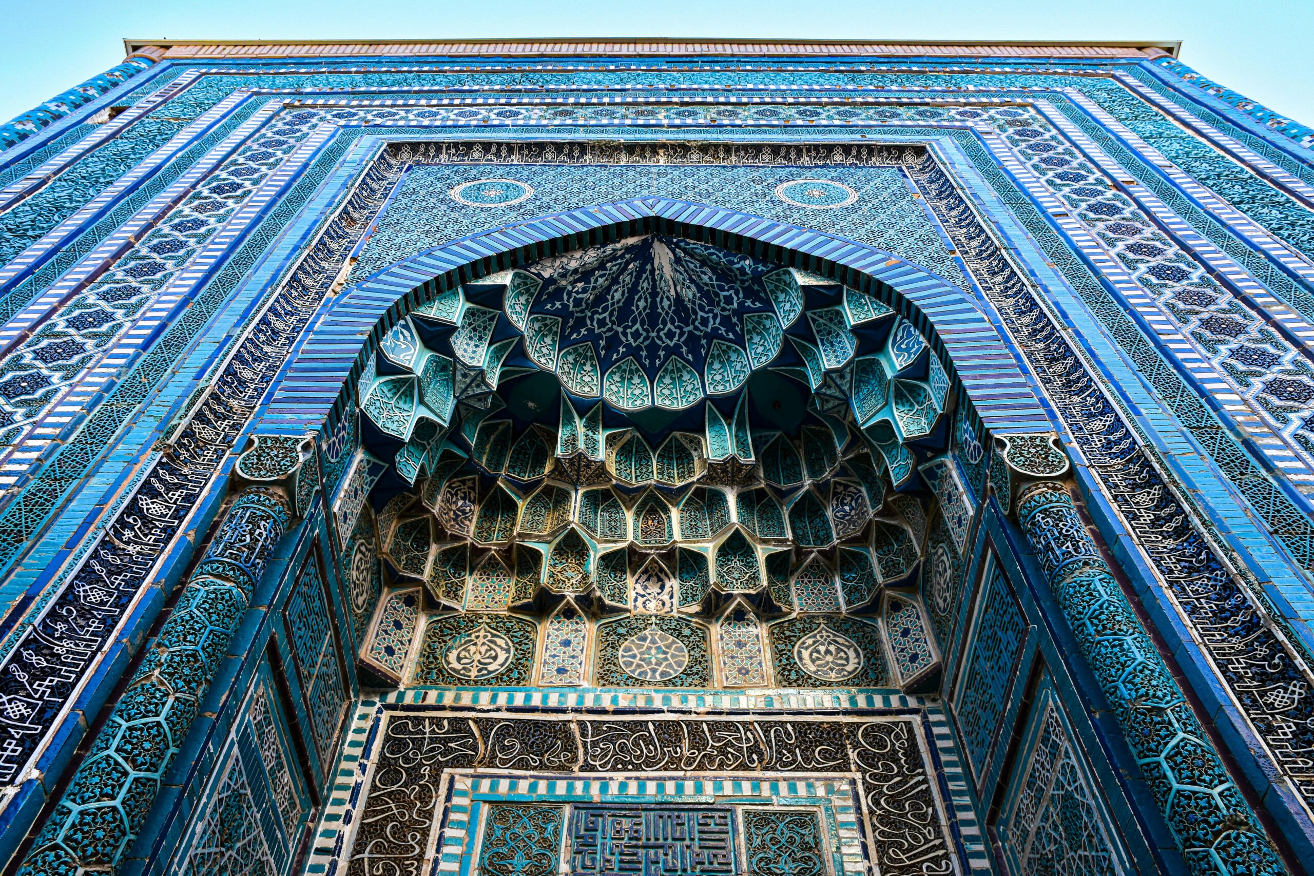 Detailed architectural tile work at Shah-i-Zinda in Samarkand, showcasing Islamic artistry.